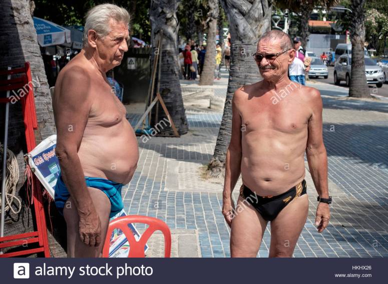 two-mature-men-with-pronounced-stomachs-and-wearing-speedos-swimming-HKHX26.jpg